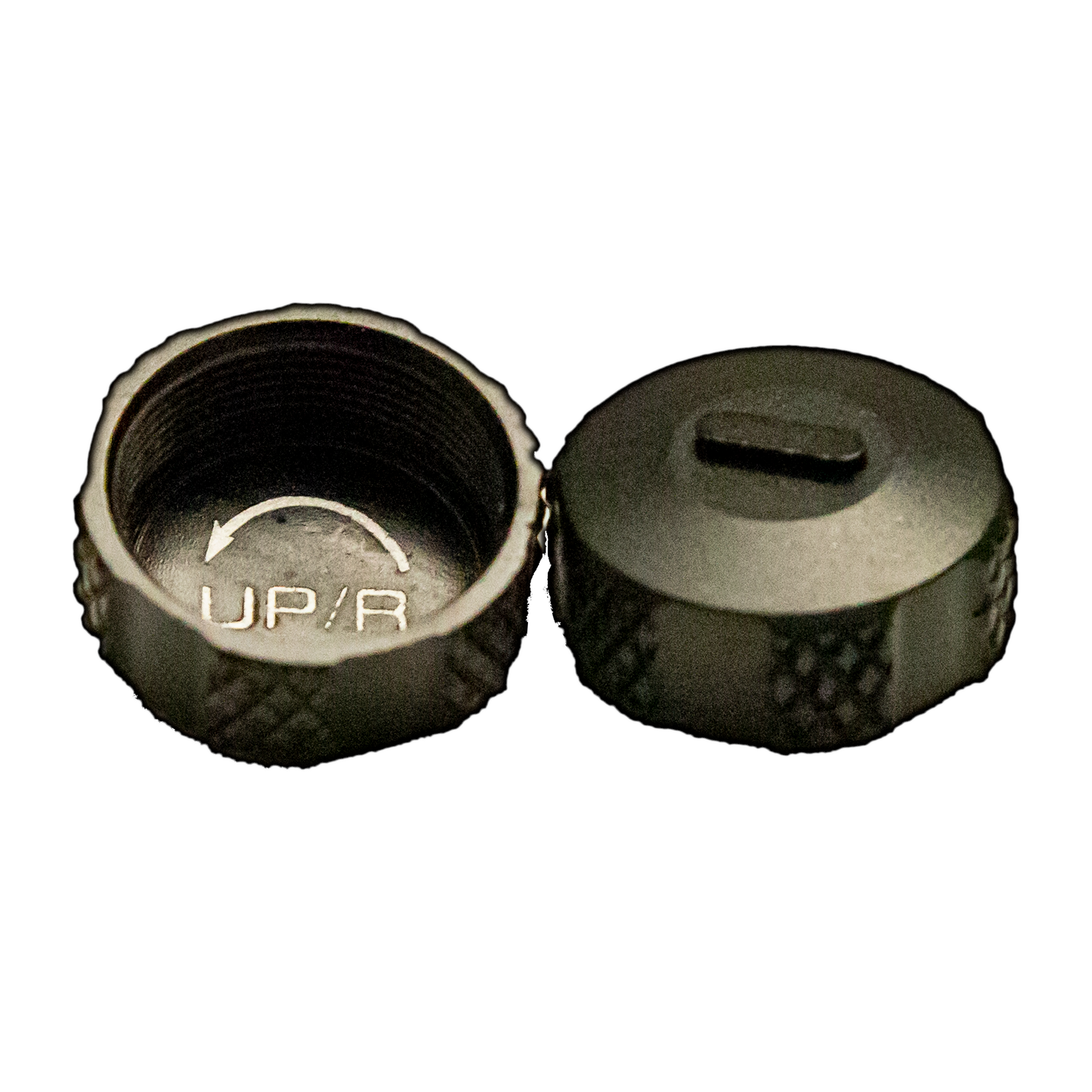 a pair of metal knobs on a black background