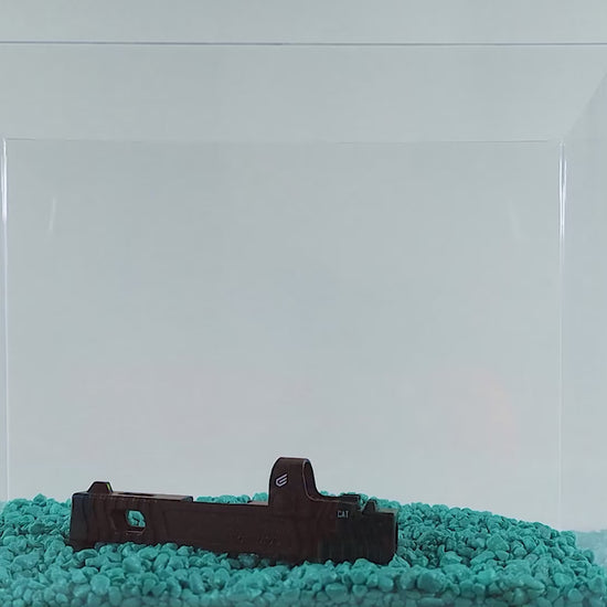 a cake in a glass case on a table